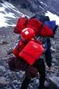 Jia Condon with his heavy load hiking below Turnweather